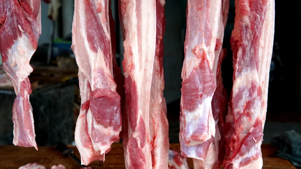 A row of hanging meat